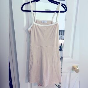 Athleisure cream one piece dress with built in shorts, skort